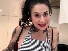 Tatted MILF fucks herself with big dildo