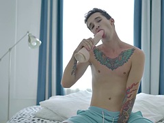 Inked twink fucks his own ass after playing with a dildo