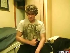 Young cutie with curly hair strokes his boner