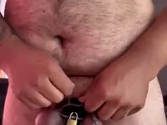 Ball tied with cock in chastity cage and anal plug insertion